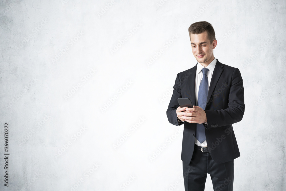 Smiling businessman using smartphone, mock up Smiling businessman using smartphone, mock up