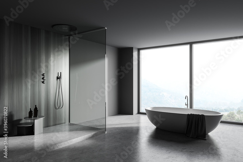 Gray and wooden bathroom corner with tub and shower © ImageFlow