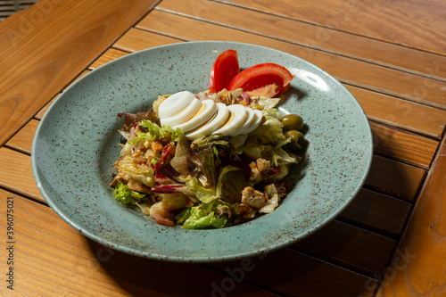 Mixed green salad with cooked eggs