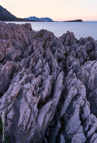 Karst in Islares, in the background Candina and Mount Buciero. Islares, Cantabrian Sea, Castro Urdiales Municipality, Cantabria, Spain, Europe photo