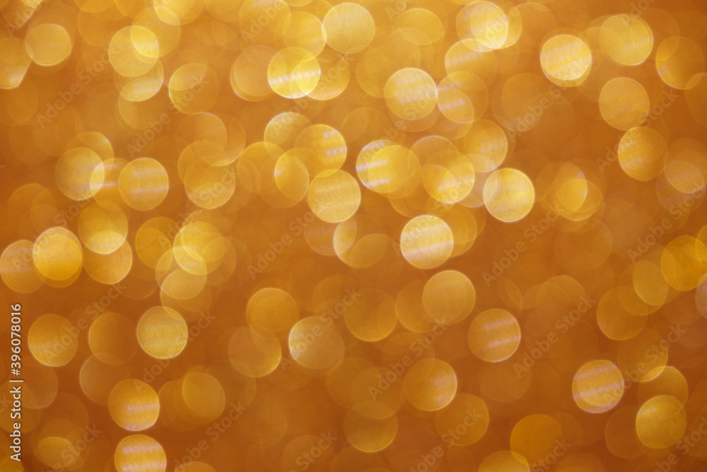 Golden yellow abstract lights background, bokeh shining, sparkling and glittering backdrop blurred image Golden yellow abstract lights background, bokeh shining, sparkling and glittering backdrop blurred image