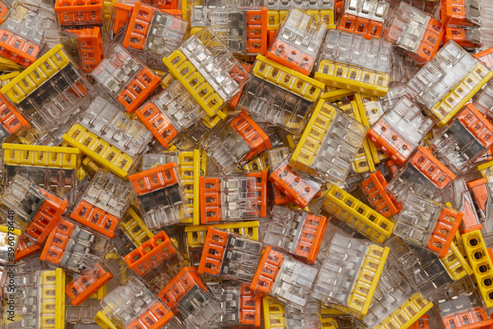 Obraz premium Electrical components as a background. Terminal block connector pairs in a box