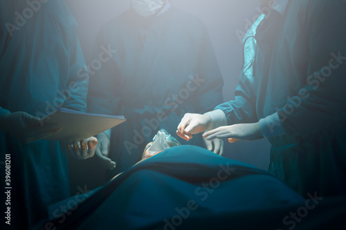 Surgical team or doctor and staff have vivisection in surgery room of the hospital and using equipment tool for the operation