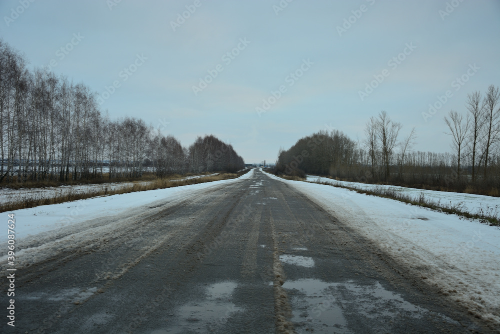 Road to the village . Photo taken in November in the evening . Road to the village . Photo taken in November in the evening .