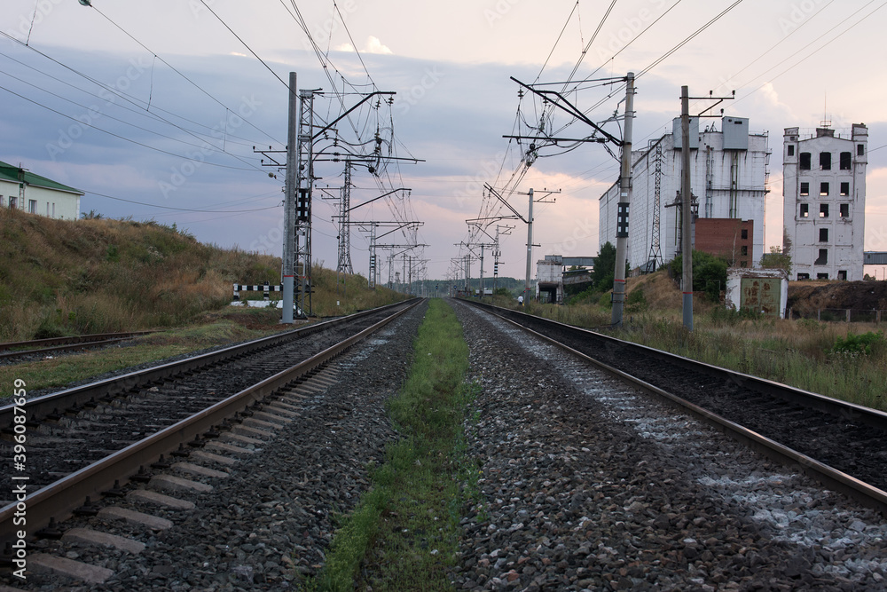 Railway track, power lines and grain elevator