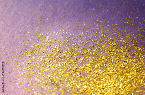 On a purple background gold. Gold sparkles on a lilac background. Background for jewelry  wrapping