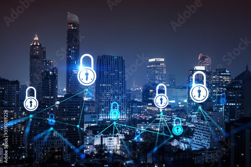 Glowing Padlock hologram  night panoramic city view of Bangkok  Asia. The concept of cyber security to protect companies. Double exposure.