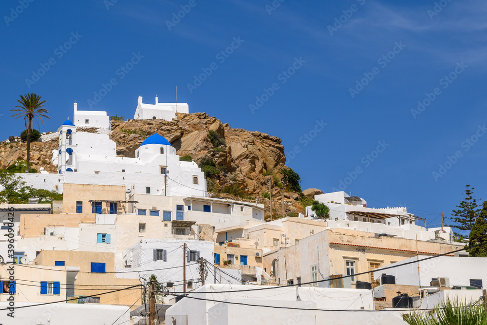 Buildings on a hill in the center of Chora on Ios Island. Cyclades, Greece