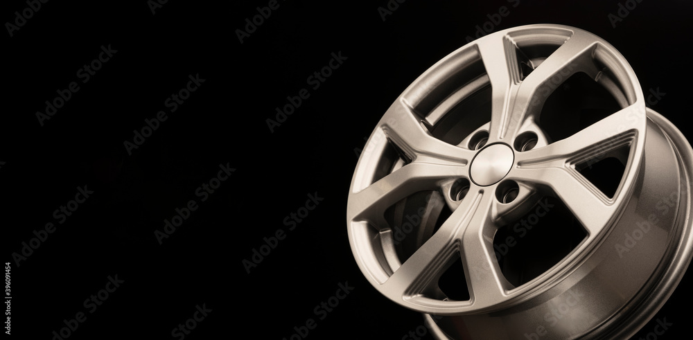 new grey silver alloy wheel on black background