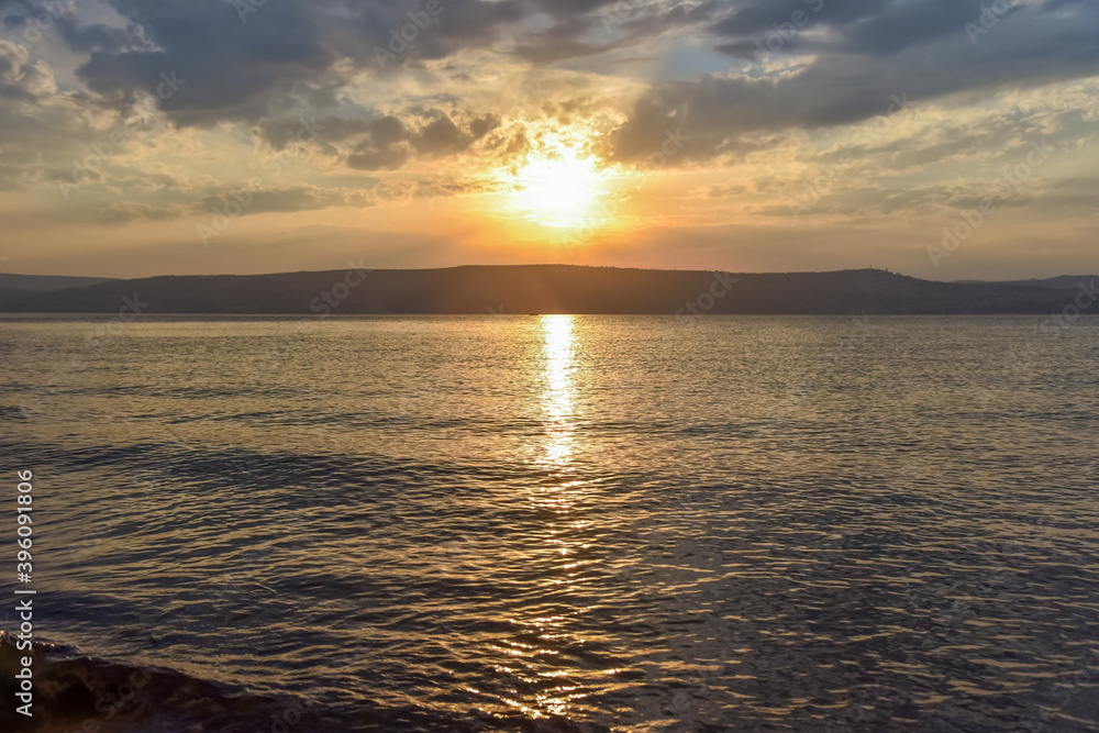 Sunset over the Sea of Galilee and Golan Heights. High quality photo.