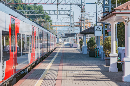 Passenger train stands at Dagomys station. Sochi.