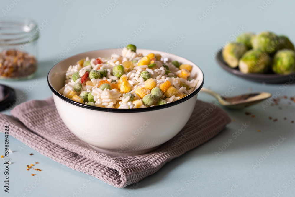Freezing of rice, peas, corn and pepper. Healthy foods for side dishes.