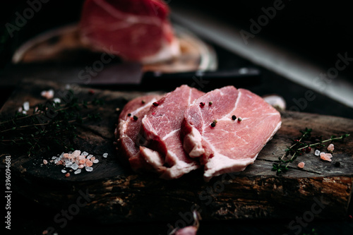 Raw pork steak on a wooden table