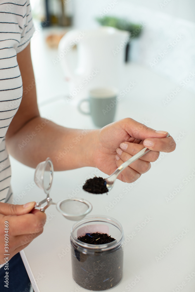 close up of a woman preparing tea close up of a woman preparing tea