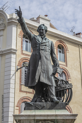 Statue of Francois Arago (sculptor Antonin Mercie, 1879) in Perpignan Place Arago. Francois Arago - French political leader, astronomer and physicist. Perpignan, Pyrenees-Orientales, France. photo