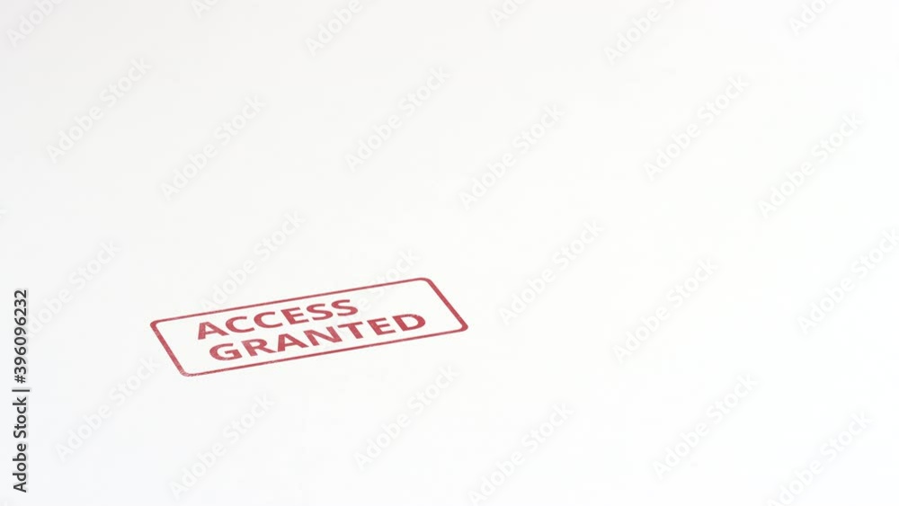 ACCESS GRANTED red rubber stamp on the paper ACCESS GRANTED red rubber stamp on the paper