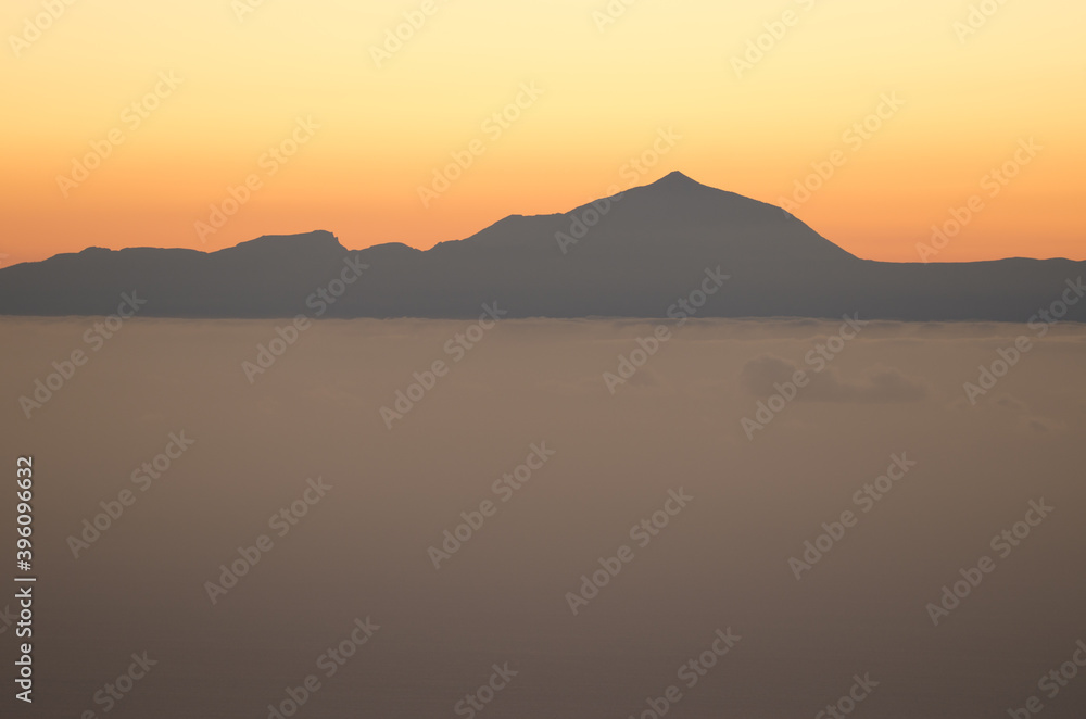Island of Tenerife and Teide peak at sunset from Gran Canaria. Canary Islands. Spain. Island of Tenerife and Teide peak at sunset from Gran Canaria. Canary Islands. Spain.