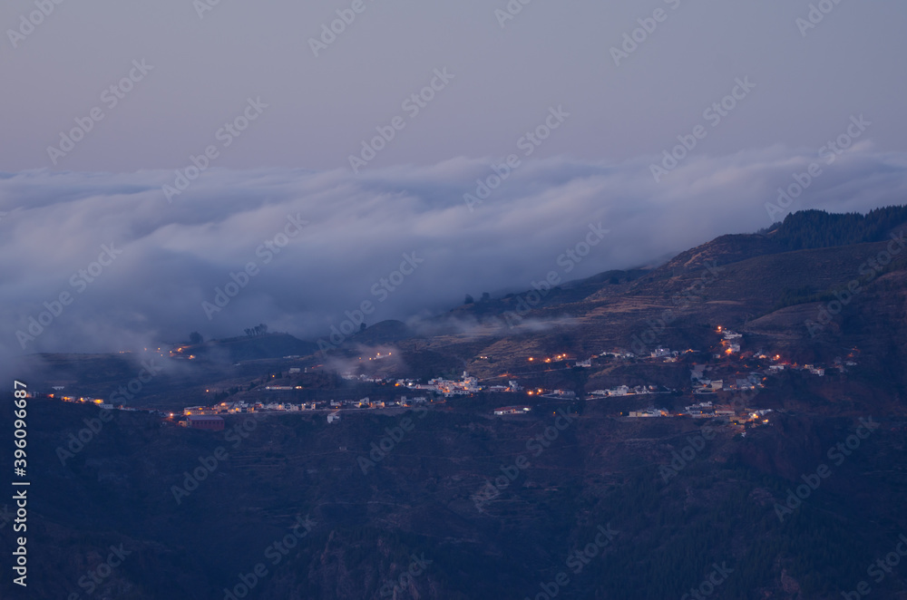 Town of Artenara at sunset and sea of clouds. The Nublo Rural Park. Gran Canaria. Canary Islands. Spain.