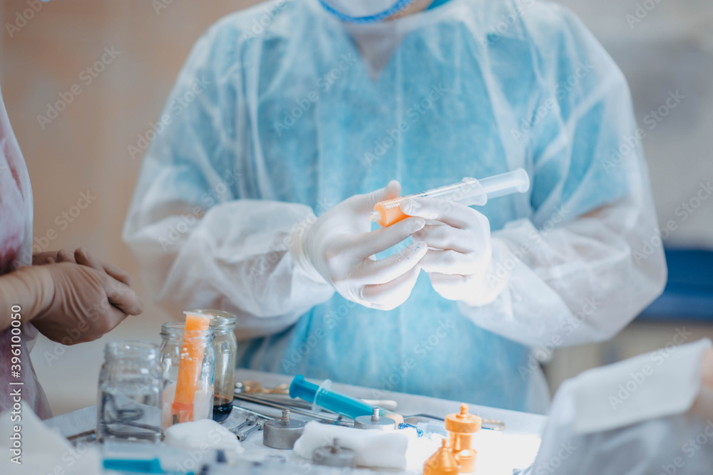 preparation of fat cells for lipofilling in the operating room. Surgical cosmetic surgery to rejuvenate the face with the introduction of stem and fat cells. preparation of fat cells for lipofilling in the operating room. Surgical cosmetic surgery to rejuvenate the face with the introduction of stem and fat cells.