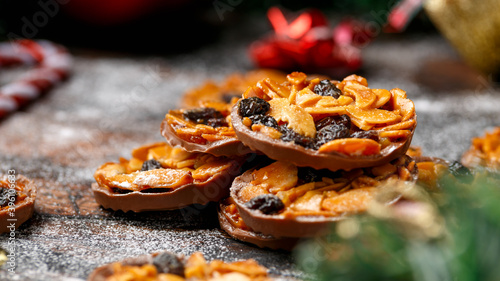 Fényképezés Christmas Chocolate Florentines cookies with almond and raisins with decoration,