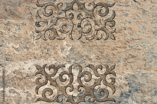 Ornamental print on the stone surface. Vintage ornament on the stone. Embossed drawing. Close-up. Stone texture. Pattern on the stone. Embossed pattern. Wallpaper. Tile
