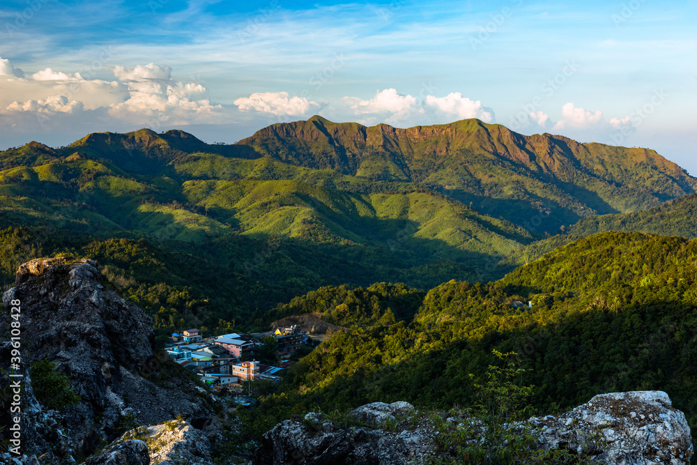 Fototapeta premium Beautiful landscape of E-Thong village and Chang Phuak Hill in the background in Thong Pha Phum National Park, Kanchanaburi, Thailand.