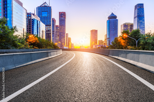 Empty asphalt road and modern cityscape in Beijing at sunset,China. © ABCDstock
