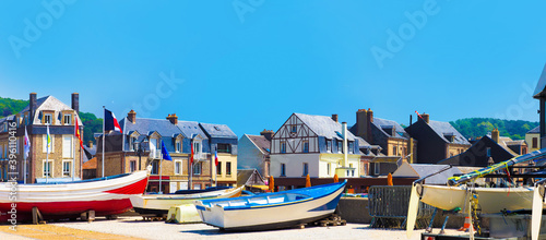 Fishing boats near country houses. Picturesque panoramic landscape beautiful city of Etretat of Normandy, France