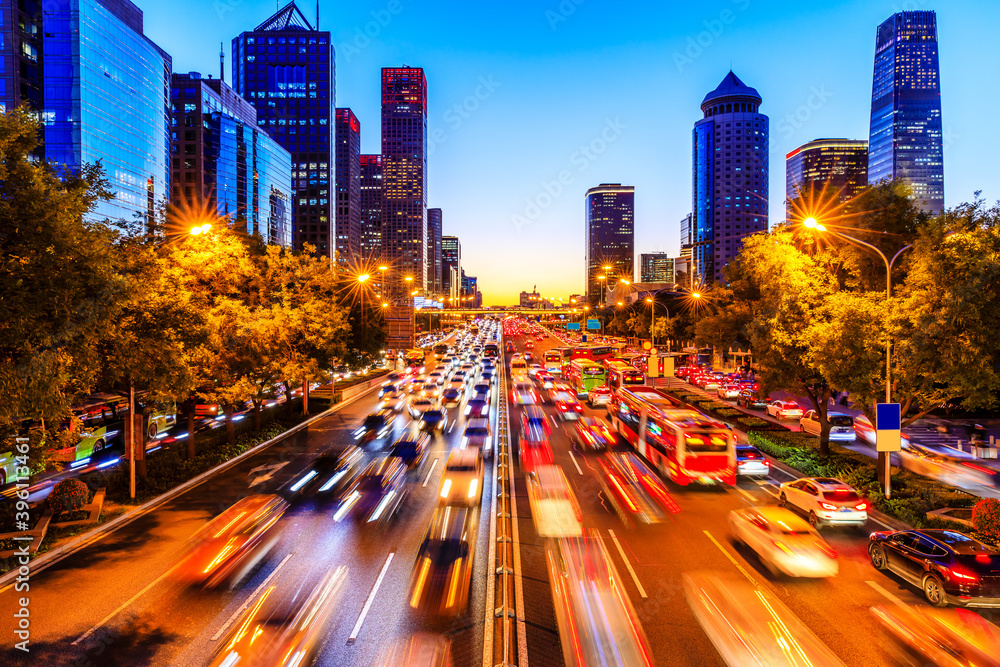 Busy city road and skyscraper buildings in Beijing at night,China.