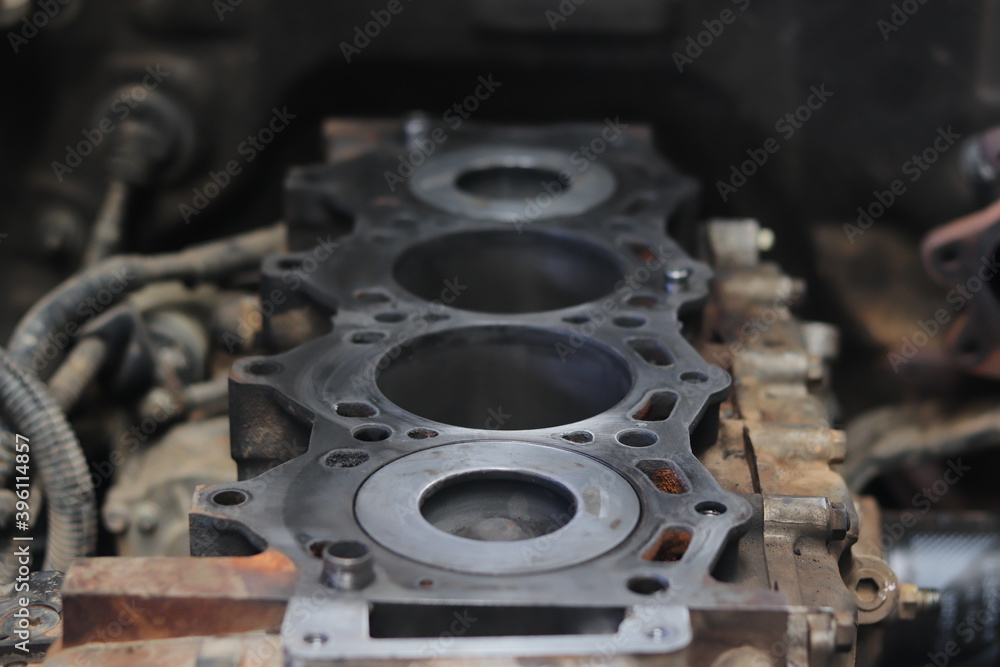 The mechanic is checking the engine. The mechanic is checking the engine.