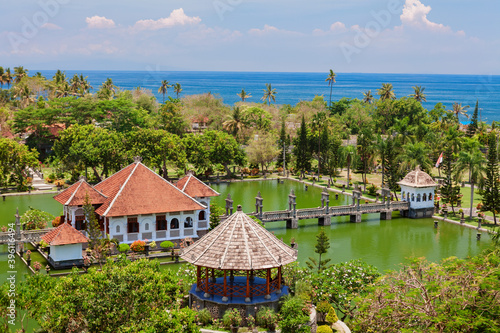 Aerial view of Taman Ujung water palace near Alampura in Karangasem on Bali Island. Ancient palace of Balinese royal family with water pools and tropical landscape park. Indonesian art and culture. photo
