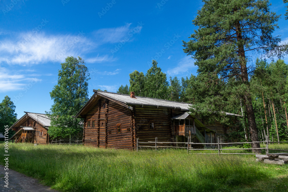 Old wooden houses on a village street in Northern Russia