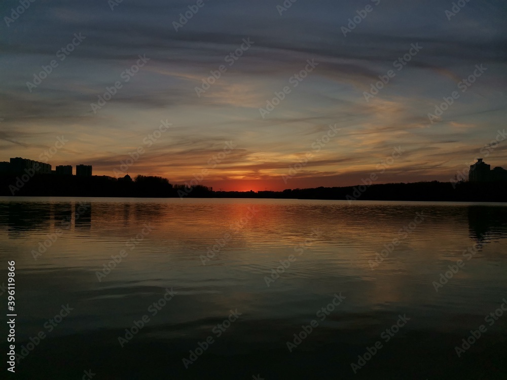 Naklejka premium sunset over the river