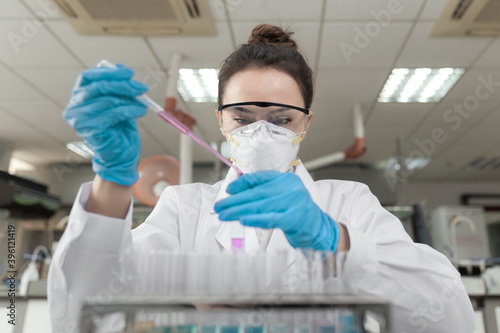 Young female scientist working in laboratory 