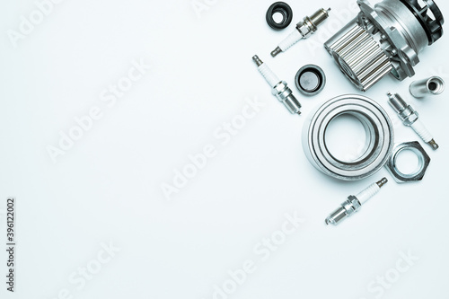 Auto equipment. Auto motor mechanic spare or automotive piece on white background. Set of new metal car part. Repair and vehicle service with space for text.