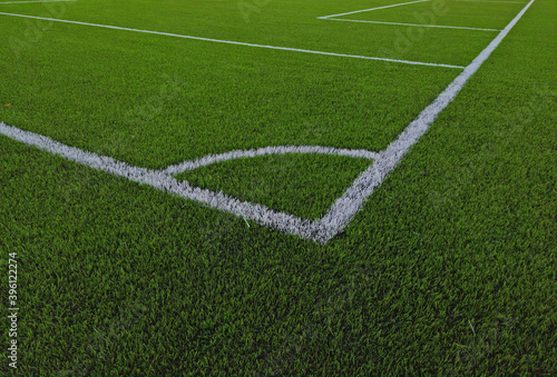 Artificial grass soccer field. Corner kick line of ball and a soccer field , football field , background texture © Smole