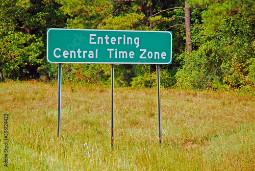 A sign advises travelers they are entering a new time zone photo