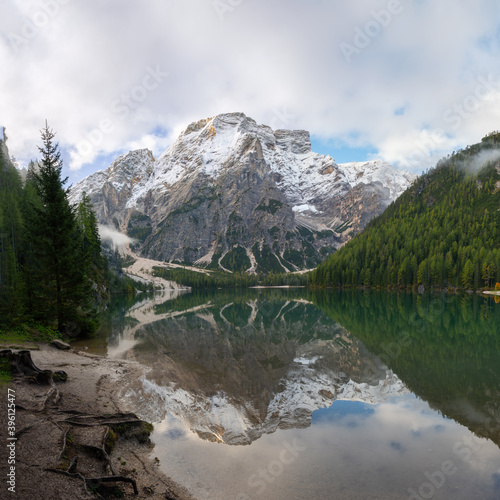 Square view of Mount Seekofel mirroring in the clear calm water of iconic mountain lake Pragser Wildsee (Lago di Braies) in Italy, Dolomites, Unesco World Heritage, South Tyrol