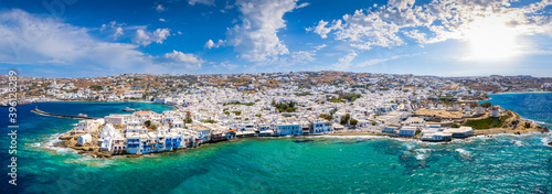 Wide aerial panorama of the town of Mykonos island, Greece, with the little venice district, the famous windmills and the old port
