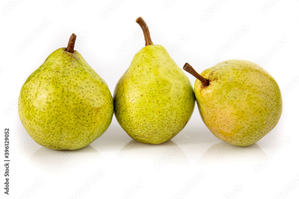 Three ripe pears isolated on white background. Still life picture taken in studio with soft-box.