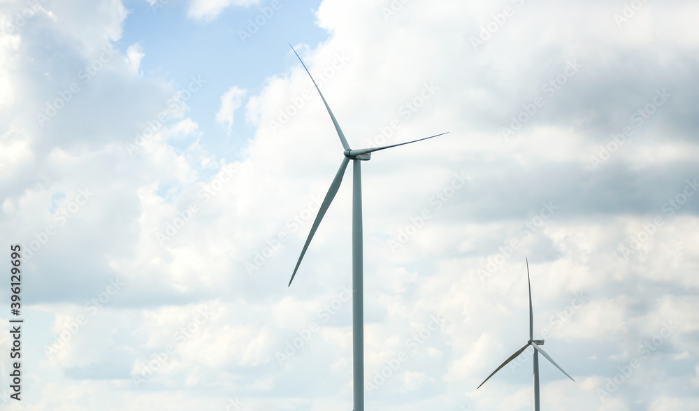 clean energy power concept, wind turbine and cloud sky. clean energy power concept, wind turbine and cloud sky.