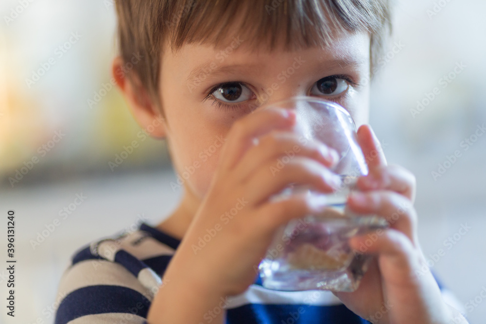 Portrait of boy drinking water Portrait of boy drinking water