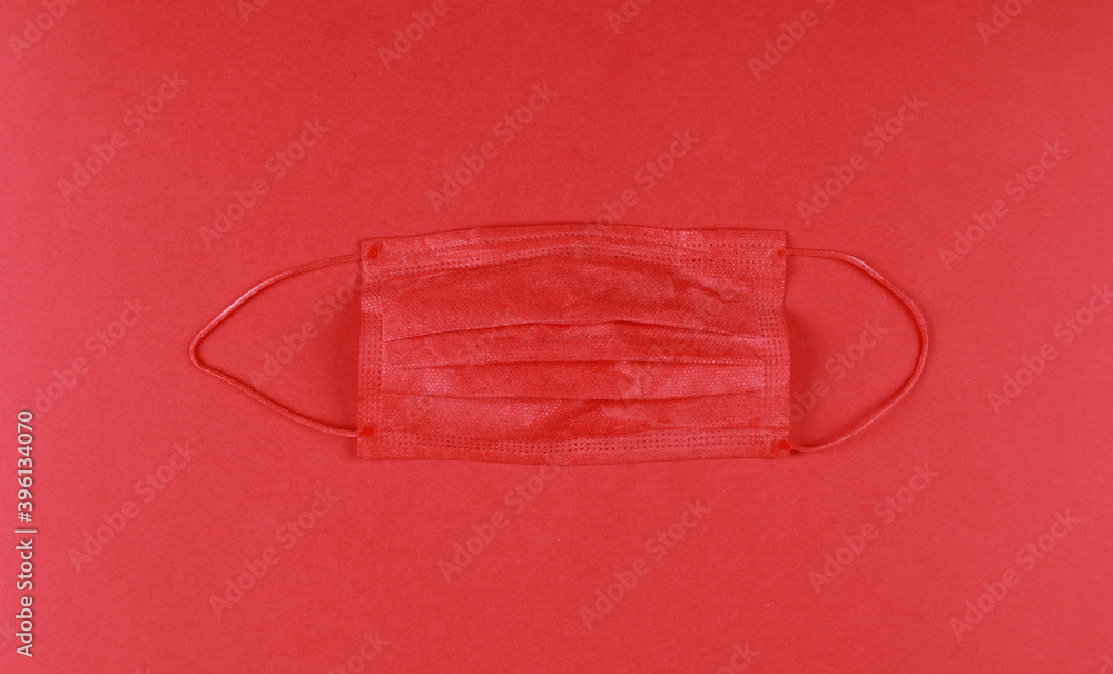christmas red medical mask isolated on red background christmas red medical mask isolated on red background