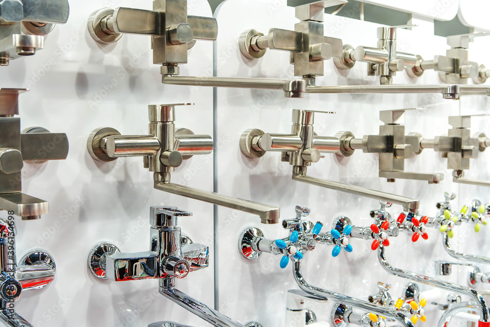 Bathroom equipment trade. An assortment of water taps in a plumbing store Bathroom equipment trade. An assortment of water taps in a plumbing store