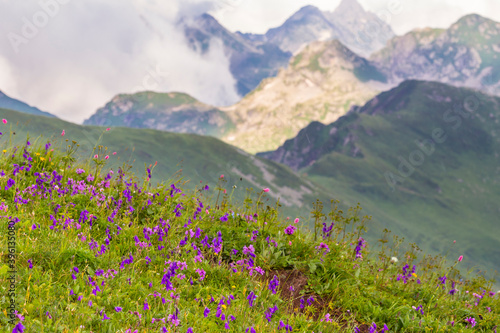 Beautiful mountain landscape at Caucasus mountains with clouds and blue sky