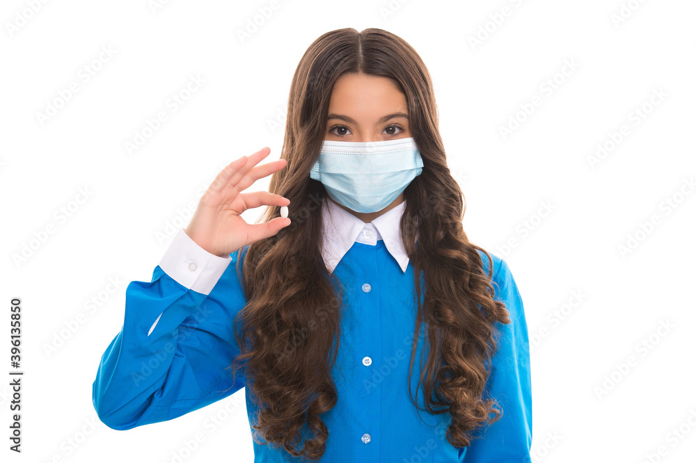 girl hold vitamins or medicine drug pills from fever wearing protective medical mask isolated on white, covid 19 girl hold vitamins or medicine drug pills from fever wearing protective medical mask isolated on white, covid 19