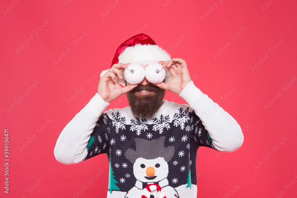 happy bearded guy in warm knitted sweater and santa claus hat hold tree decorative snowballs celebrate winter holiday of chistmas, christmas decor
