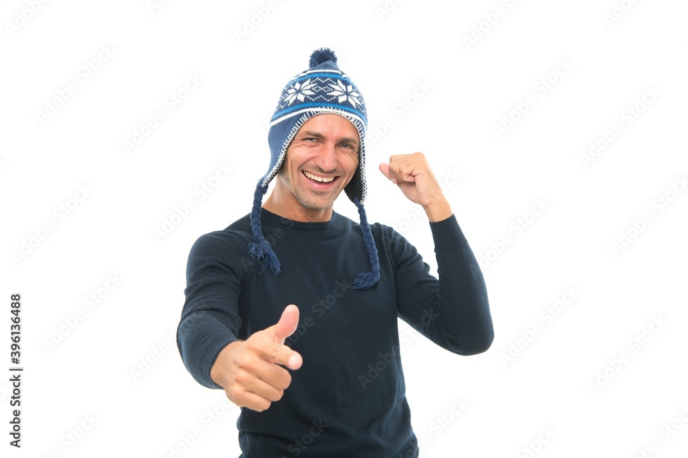 mature happy man in knitted hat. cheerful guy pointing finger. male knitwear accessory. warm winter clothing fashion. man isolated on white. keep head warm. feel comfortable mature happy man in knitted hat. cheerful guy pointing finger. male knitwear accessory. warm winter clothing fashion. man isolated on white. keep head warm. feel comfortable