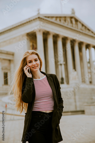 Beautiful smiling woman usi...