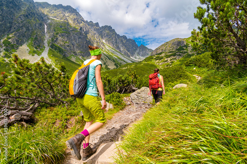 Young active girls trekking in High Tatras mountains, Slovakia